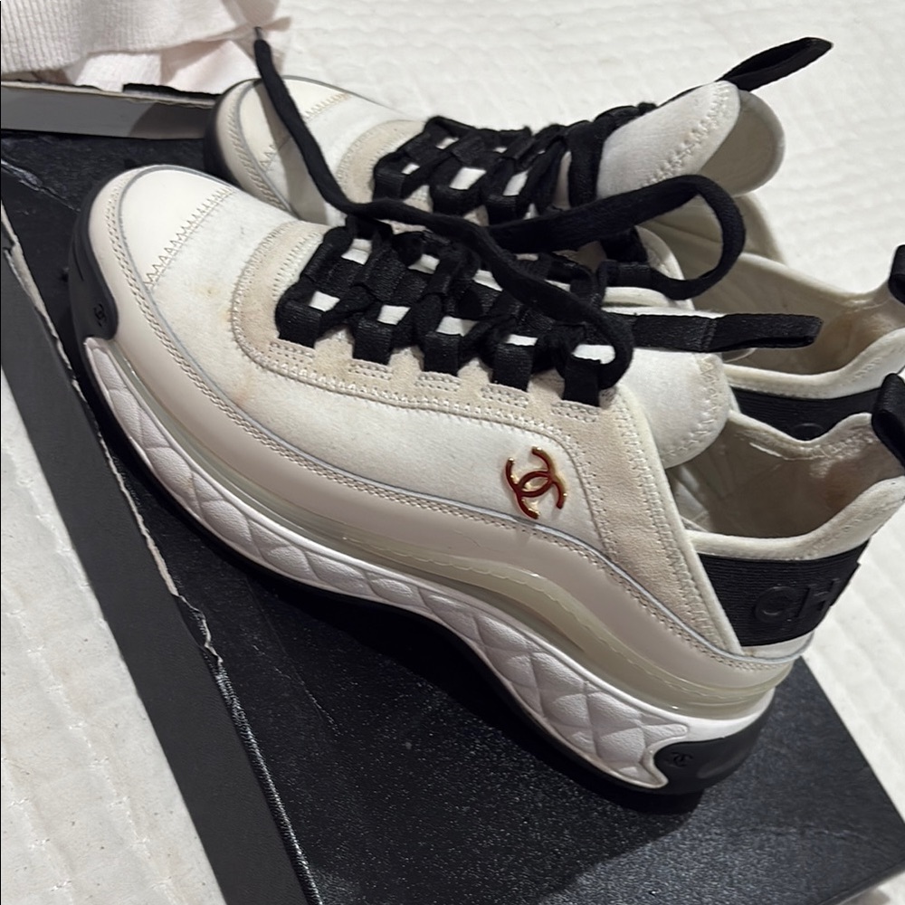 CHANEL White and Black Sneakers with Gold Logo